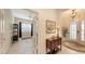 Bright and airy entryway with tile flooring, decorative accents, and French doors leading to an office at 13789 Old Creek Ct, Parrish, FL 34219