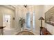 Bright entryway with tile flooring, a coat closet, and a half-bathroom at 13789 Old Creek Ct, Parrish, FL 34219
