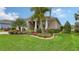 House exterior showcasing landscaping and palm trees at 13789 Old Creek Ct, Parrish, FL 34219