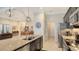 Modern kitchen with granite countertops and stainless steel appliances at 13789 Old Creek Ct, Parrish, FL 34219