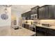 Modern kitchen with stainless steel appliances and granite countertops at 13789 Old Creek Ct, Parrish, FL 34219
