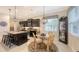 Kitchen with an island, breakfast nook, and dark cabinetry at 13789 Old Creek Ct, Parrish, FL 34219