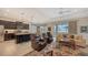 Open floor plan with kitchen island, stainless steel appliances, and living area at 13789 Old Creek Ct, Parrish, FL 34219
