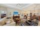 Spacious living room with hardwood floors, comfortable seating, and an open floor plan at 13789 Old Creek Ct, Parrish, FL 34219