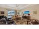 Relaxing living area with comfy seating and access to backyard patio at 13789 Old Creek Ct, Parrish, FL 34219