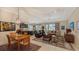Open living room featuring comfortable seating, large TV, and views to backyard at 13789 Old Creek Ct, Parrish, FL 34219