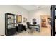 Spacious home office with built-in shelving, desk, and printer at 13789 Old Creek Ct, Parrish, FL 34219