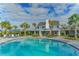 Resort-style pool with lounge chairs and clubhouse at 13789 Old Creek Ct, Parrish, FL 34219