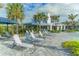 Relaxing pool area with lounge chairs and umbrellas at 13789 Old Creek Ct, Parrish, FL 34219
