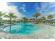 Expansive community pool with numerous lounge chairs at 13789 Old Creek Ct, Parrish, FL 34219