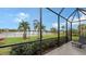 Screened patio with a tranquil lake view at 13789 Old Creek Ct, Parrish, FL 34219