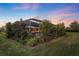 Landscaped backyard with lush greenery and screened patio area at 17424 Cresswind Ter, Bradenton, FL 34211