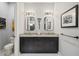 Elegant bathroom with double vanity and granite countertops at 17424 Cresswind Ter, Bradenton, FL 34211