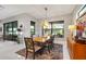 Elegant dining room with wood table, modern chairs, and large windows at 17424 Cresswind Ter, Bradenton, FL 34211