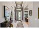Bright and spacious entryway with console table and modern artwork at 17424 Cresswind Ter, Bradenton, FL 34211