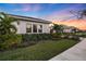 Modern home exterior with lush landscaping and sunset view at 17424 Cresswind Ter, Bradenton, FL 34211