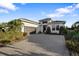 Luxury home with gray brick driveway and well-manicured landscaping at 17424 Cresswind Ter, Bradenton, FL 34211