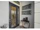 Elegant black front door with glass panels and decorative wall art at 17424 Cresswind Ter, Bradenton, FL 34211