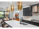 Modern kitchen with an island, stainless steel appliances, and marble countertops at 17424 Cresswind Ter, Bradenton, FL 34211