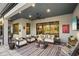 Relaxing covered patio with comfortable seating and outdoor TV at 17424 Cresswind Ter, Bradenton, FL 34211