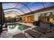 Stunning pool area with covered lanai, lounge chairs, and sunset views at 17424 Cresswind Ter, Bradenton, FL 34211