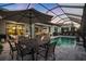 Relaxing pool area with covered patio, outdoor seating, and dining area at 17424 Cresswind Ter, Bradenton, FL 34211