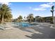 Community pool with lounge chairs and palm trees at 17424 Cresswind Ter, Bradenton, FL 34211