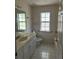 Bathroom features a single vanity and tub shower at 4760 Camphor Ave, Sarasota, FL 34231