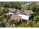 Aerial view of a two-story home with brown roof and attached garage at 6012 Courtside Dr # 1, Bradenton, FL 34210