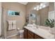 Clean bathroom with single vanity, shower/tub combo, and window at 6476 Royal Tern Cir, Lakewood Ranch, FL 34202