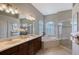 Elegant bathroom with double vanity, soaking tub, and walk-in shower at 6476 Royal Tern Cir, Lakewood Ranch, FL 34202