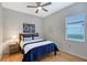 Charming bedroom with a queen-size bed and hardwood floors at 6476 Royal Tern Cir, Lakewood Ranch, FL 34202