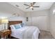 Bright bedroom with wood bed frame, neutral walls and carpet at 6476 Royal Tern Cir, Lakewood Ranch, FL 34202