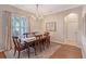 Formal dining room with hardwood floors, chandelier, and large window at 6476 Royal Tern Cir, Lakewood Ranch, FL 34202