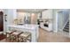 Modern kitchen with white cabinets, stainless steel appliances, and a large island at 6476 Royal Tern Cir, Lakewood Ranch, FL 34202