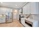 Modern kitchen with stainless steel appliances and white cabinetry at 6476 Royal Tern Cir, Lakewood Ranch, FL 34202
