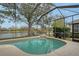 Enclosed pool and spa overlooking lake at 6476 Royal Tern Cir, Lakewood Ranch, FL 34202