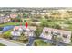 Aerial view showing condo location, golf course, and lake at 6609 Stone River Rd # 104, Bradenton, FL 34203