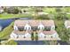 Condo building aerial view showcasing roofline and landscaping at 6609 Stone River Rd # 104, Bradenton, FL 34203