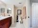 Bathroom with toilet, vanity, and plenty of storage at 6609 Stone River Rd # 104, Bradenton, FL 34203