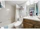 Clean bathroom with tub, toilet and modern vanity at 6609 Stone River Rd # 104, Bradenton, FL 34203