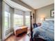 Bedroom with bay window offering scenic views and a peaceful ambiance at 6609 Stone River Rd # 104, Bradenton, FL 34203
