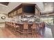 Community bar with granite counter, wood finishes, and comfortable seating at 6609 Stone River Rd # 104, Bradenton, FL 34203