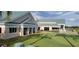 Community clubhouse with green space and putting green at 6609 Stone River Rd # 104, Bradenton, FL 34203
