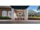 Inviting community entrance with brick columns and landscaping at 6609 Stone River Rd # 104, Bradenton, FL 34203