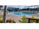 Relaxing community pool with plenty of lounge chairs at 6609 Stone River Rd # 104, Bradenton, FL 34203