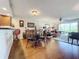 Dining area with wood floors and a glass-top table at 6609 Stone River Rd # 104, Bradenton, FL 34203