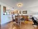 Open dining area with hardwood floors and kitchen views at 6609 Stone River Rd # 104, Bradenton, FL 34203