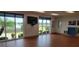 Exercise room with hardwood floors and large windows at 6609 Stone River Rd # 104, Bradenton, FL 34203