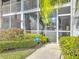 Condo building exterior, showing entrance and landscaping at 6609 Stone River Rd # 104, Bradenton, FL 34203
